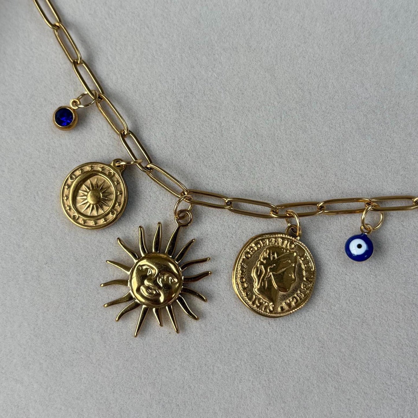 Gold Charm Necklace with Sun, Evil Eye, and Coin